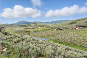 View of mountain background featuring rural landscape