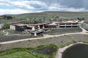 Aerial view of property's location featuring a mountain backdrop