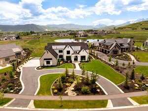 Aerial perspective of suburban area featuring a water and mountain view