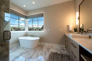 Bathroom with vanity, marble finish floors, a soaking tub, recessed lighting, and a stall shower
