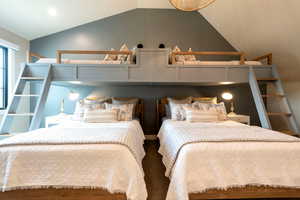 Bedroom featuring lofted ceiling