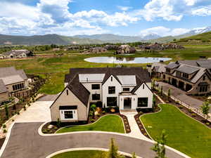 Aerial perspective of suburban area with a water and mountain view