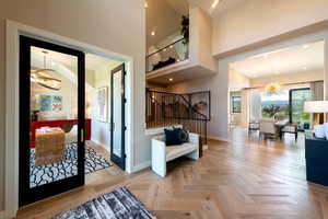 Foyer with a chandelier and stairway