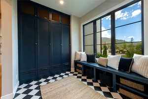Mudroom featuring light flooring and a mountain view