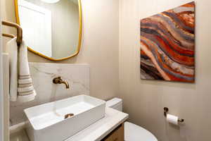 Bathroom featuring toilet and vanity