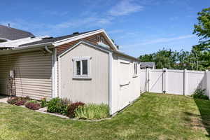 View of outbuilding with a gate