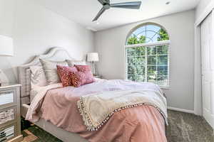 Bedroom with carpet, multiple windows, recessed lighting, a ceiling fan, and a closet