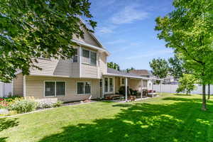 Rear view of property featuring a patio area
