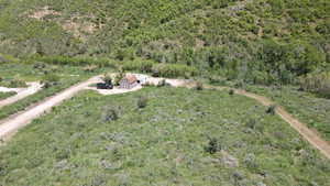 View of subject property with a heavily wooded area
