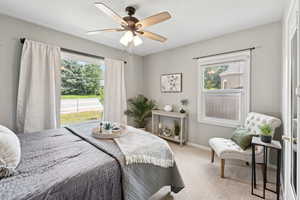 Bedroom with carpet flooring and ceiling fan