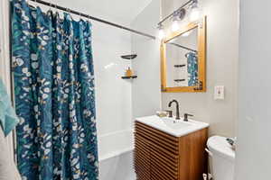 Full bathroom featuring vanity and shower / bath combo