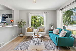 Living room with wood finished floors and baseboards