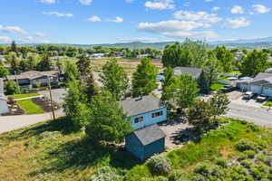 Aerial view of residential area featuring a mountain backdrop