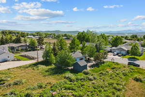 Aerial perspective of suburban area featuring a mountain backdrop