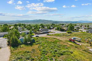Aerial perspective of suburban area with a mountain backdrop