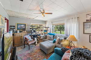 Living area featuring ceiling fan
