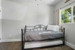 Bedroom with carpet and baseboards