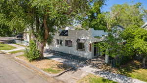 View of front facade featuring stucco siding