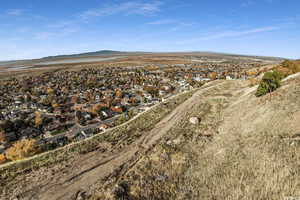 View of property location featuring a mountainous background and nearby suburban area