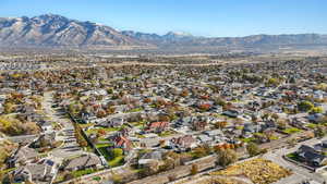 View of property location featuring a mountain backdrop and nearby suburban area