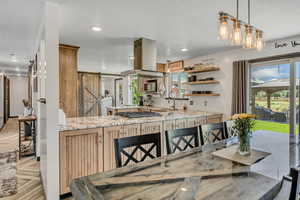 Dining area with a barn door and recessed lighting