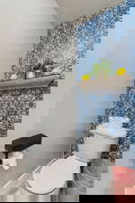 Bathroom featuring toilet and a textured ceiling