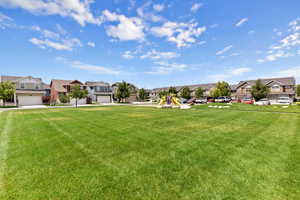 View of grassy yard with a residential view