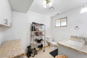 Bathroom with toilet and vanity