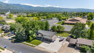 Aerial view of residential area featuring a mountain backdrop