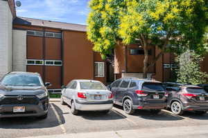 View of property with uncovered parking