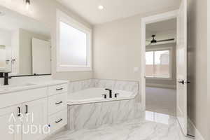 Full bath with vanity, marble finish flooring, a bath, ceiling fan, and recessed lighting