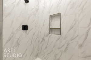 Bathroom view of a tile shower