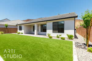 Rear view of property featuring stucco siding and a patio area