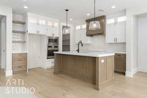 Kitchen with stainless steel appliances, a sink, open shelves, backsplash, and recessed lighting