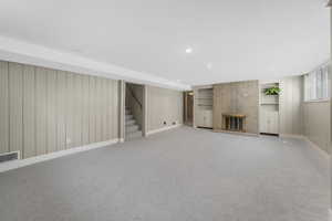 Down stairs family room with gas fireplace (insert needed); built in shelves; daylight windows