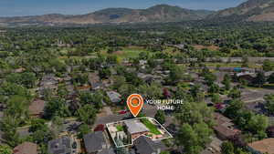 Aerial overview of property's location with property parcel outlined, mountains in background