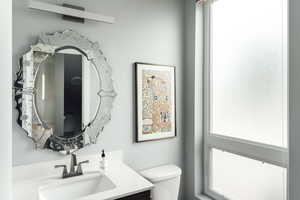 Bathroom featuring toilet and vanity