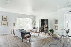 Living area featuring wood finished floors and baseboards