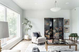 Living room with wood finished floors and baseboards