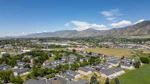 Aerial view of residential area featuring a mountainous background