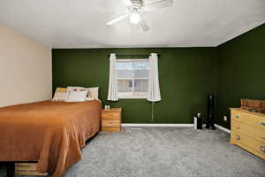 Bedroom featuring carpet and ceiling fan