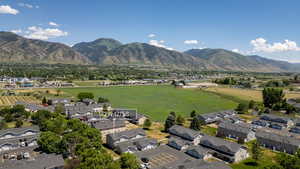 View of mountain background featuring nearby suburban area