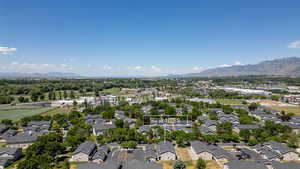 Aerial view of residential area featuring mountains