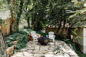 View of patio featuring an outdoor fire pit