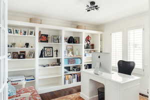 Office area featuring ornamental molding and wood finished floors