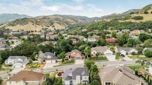Aerial view of residential area with a mountain backdrop