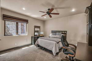 Bedroom with recessed lighting, carpet floors, an office area, and a ceiling fan