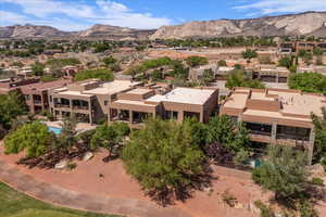 Aerial perspective of suburban area featuring a mountainous background