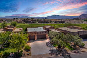 Aerial perspective of suburban area with a mountainous background