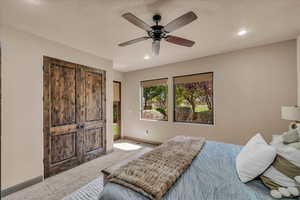 Carpeted bedroom with recessed lighting, ceiling fan, and access to outside